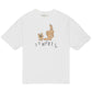 The Domrebel Friendly T-Shirt Ivory by DOM REBEL showcases a hand-drawn teddy bear with a sign, lounging beside a statue, and the bold "DO REBEL" text below. Part of the bon vivant collection, it adds quirky charm to any outfit.
