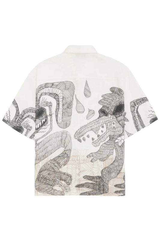 The Domrebel Hao Shirt Beige by DOM REBEL features short sleeves and a collage of abstract black and white patterns, complemented by graphite character drawings of creatures and geometric shapes on soft linen fabric.