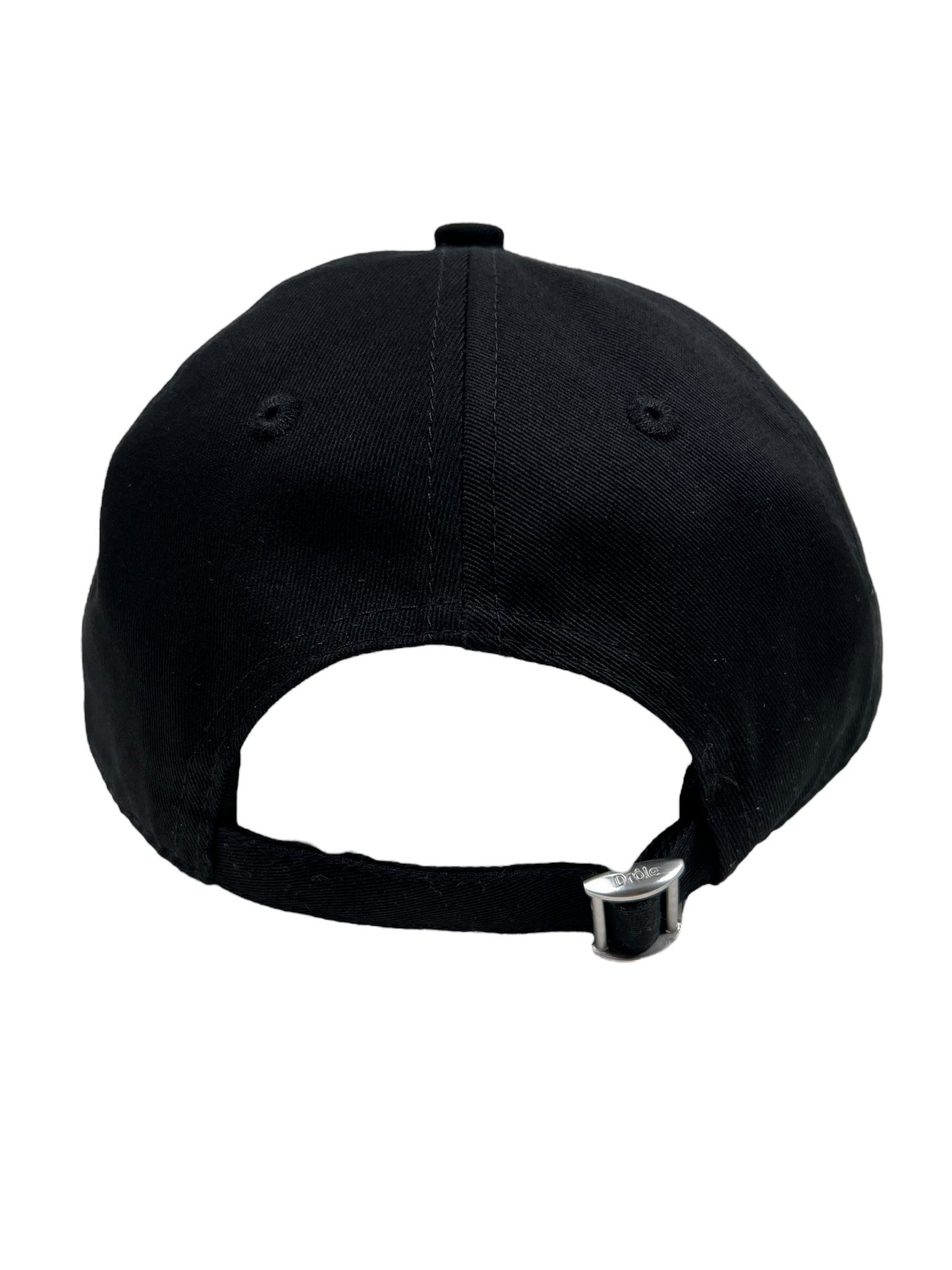 The image showcases the back view of DROLE DE MONSIEUR's DROLE DE MONSIEUR CP151-CO138-BL LA CASQUETTE SLOGAN BLK, a black baseball cap with an adjustable strap and buckle, featuring 'Not From Paris Madame' embroidered on it. This stylish 100% cotton hat is perfect for any casual outfit.