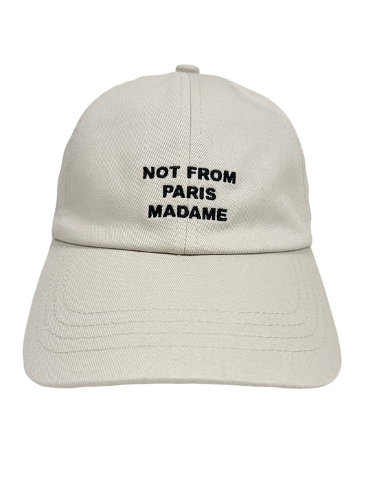 A DROLE DE MONSIEUR CP151-CO138-MT LA CASQUETTE SLOGAN MASTIC with an adjustable strap and the phrase "NOT FROM PARIS MADAME" elegantly embroidered in black on the front.