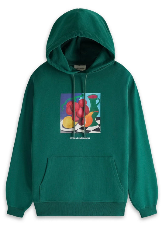 Drole de Monsieur green hoodie with abstract art design on the front, made from 100% cotton French terry sweatshirt material.
