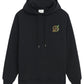 The DROLE DE MONSIEUR E-HO170-CO127-BL LE HOODIE RAISIN BLK is a black hooded sweatshirt made from French terry cotton, featuring a drawstring, front pocket, and a small embroidered "D" on the left chest.