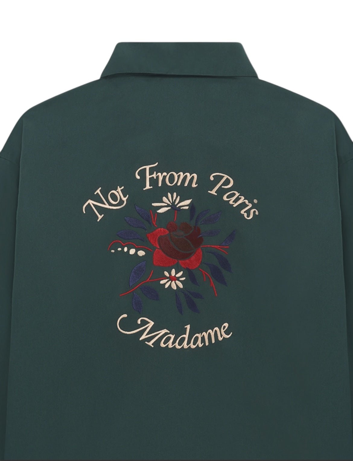 A dark green long-sleeved shirt with "Not From Paris Madame" and a Slogan Fleurs embroidery design on the back, from DROLE DE MONSIEUR's E-SH189-PL LA CHEMISE SLOGAN FLEUR GRN collection.