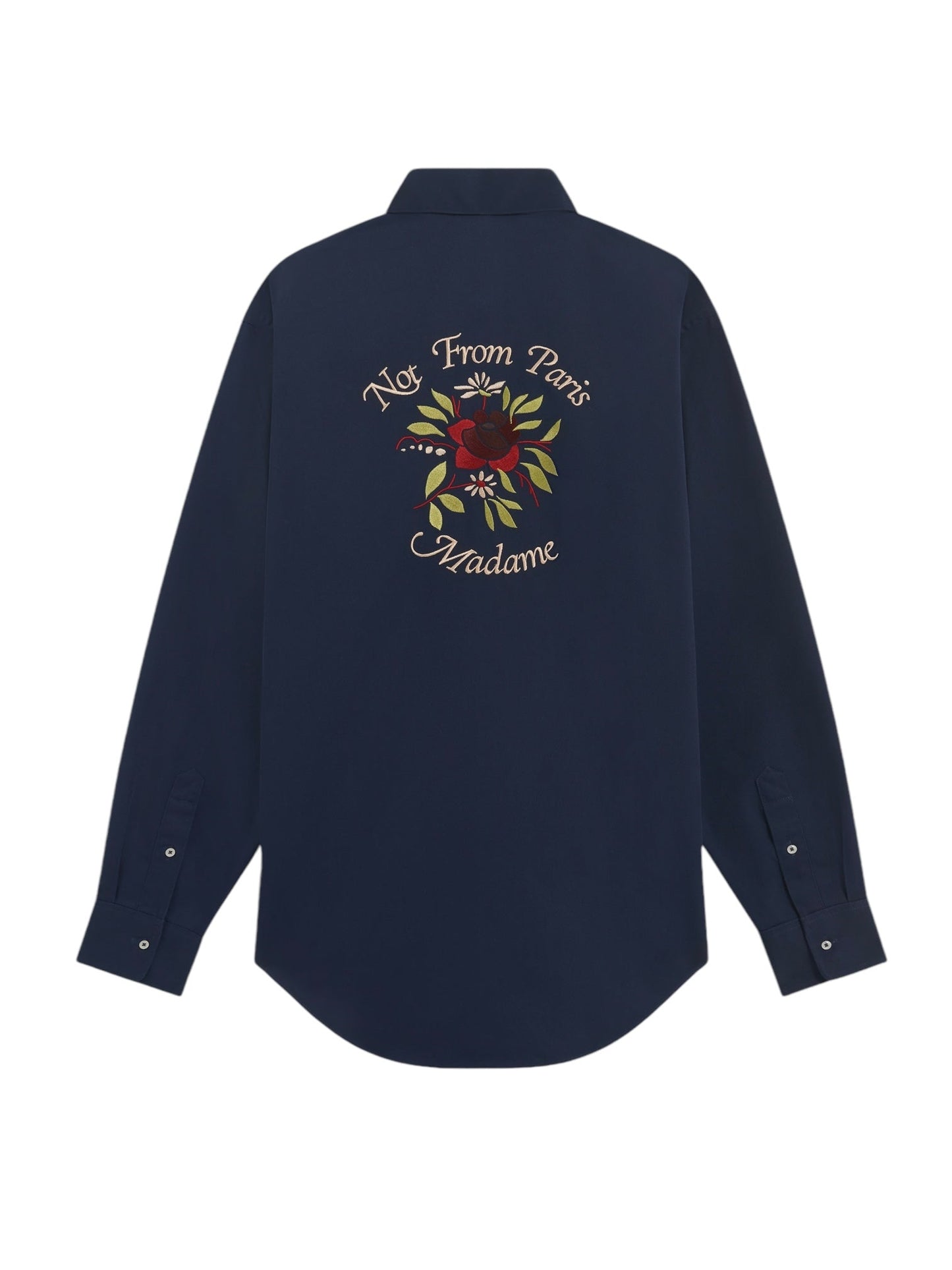 The DROLE DE MONSIEUR E-SH189-PL149-NY LA CHEMISE NAVY is a navy long-sleeved shirt that features an embroidered design on the back, showcasing the slogan "Not From Paris Madame" above a rose graphic. It is complemented by a convenient chest patch pocket.