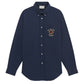 The DROLE DE MONSIEUR E-SH189-PL149-NY LA CHEMISE NAVY is a long-sleeved shirt that comes in a navy hue, boasts a chest patch pocket with white buttons, and features an embroidery on the left pocket saying, "Yes From Texas, Cactus.