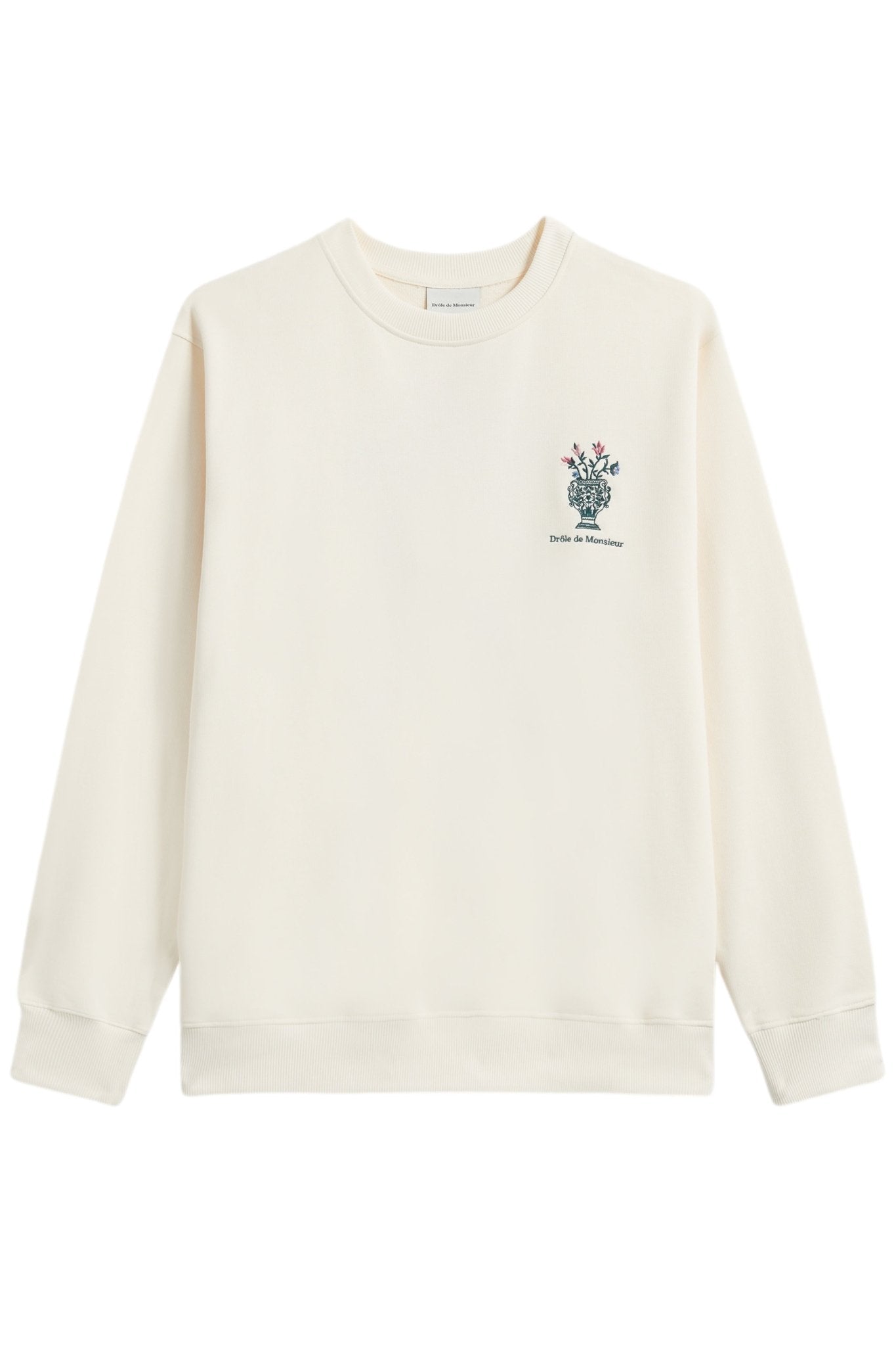 A cream-colored French terry sweatshirt by DROLE DE MONSIEUR, featuring a small floral vase embroidery and the text "Drôle de Monsieur" printed on the left chest area. Model: E-SW153-CO127-CM LE SWEATSHIRT CREAM.