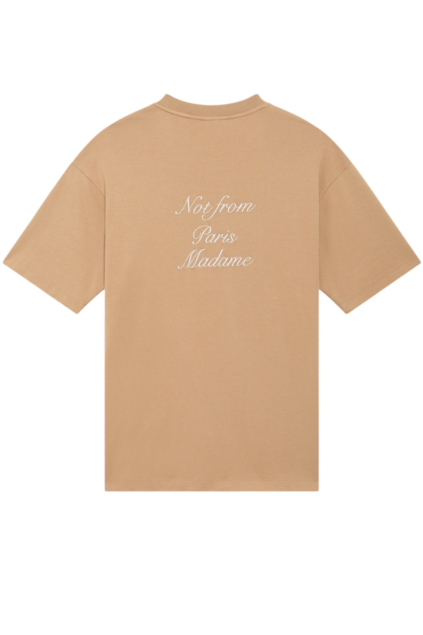 Beige cotton t-shirt, model E-TS209-CO002-IBN LE T-SHIRT BRW by DROLE DE MONSIEUR, featuring short sleeves and a crew neck. Made from soft interlock fabric with the phrase "Not From Paris Madame" elegantly printed in white on the left chest area.