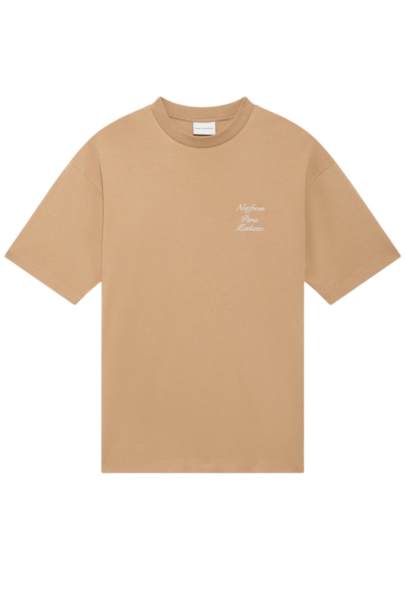 A beige cotton t-shirt from DROLE DE MONSIEUR, featuring the cursive text "Not from Paris Madame" elegantly written in white.