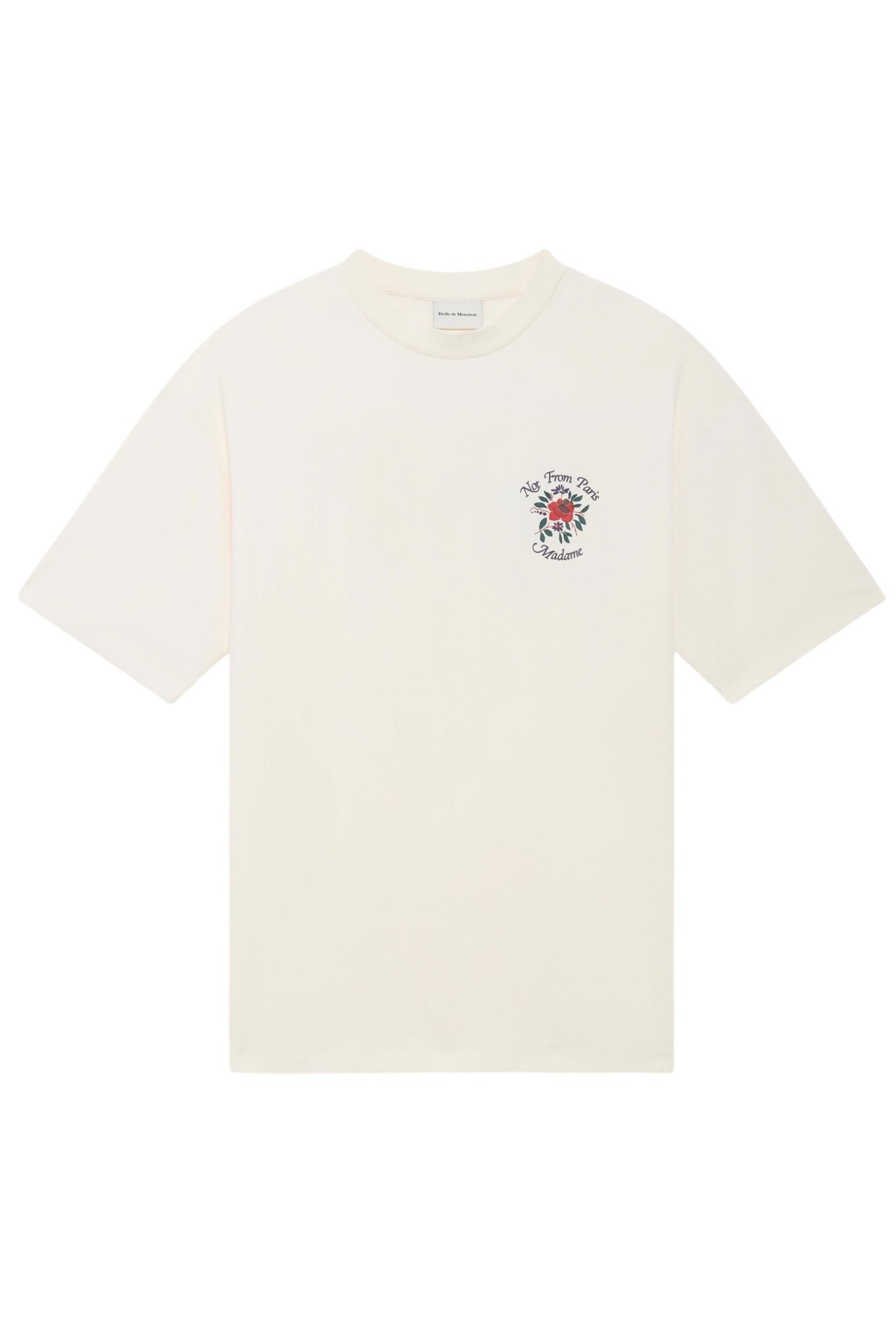 The DROLE DE MONSIEUR E-TS210-CO002-CM LE T-SHIRT CREAM is a plain white cotton T-shirt featuring a small intricate graphic and slogan fleurs text on the upper left chest area.