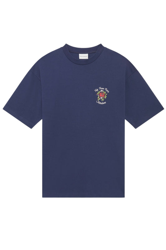 A DROLE DE MONSIEUR E-TS210-CO002-NY Le T-Shirt Slogan Navy, made from 100% cotton, featuring short sleeves and a small colorful floral graphic with text on the left chest area.