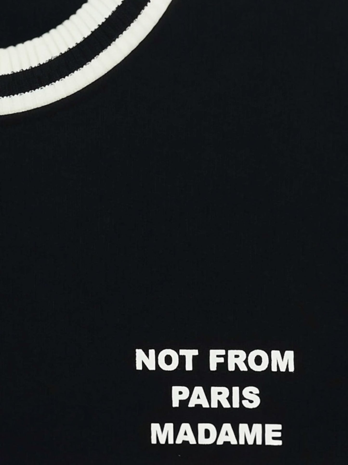 The Drôle de Monsieur F-SW140-CO127-Bl Le Sweatshirt Black is a 100% cotton black shirt with "NOT FROM PARIS MADAME" in white text on the front, ideal for relaxed outings or cozy nights.