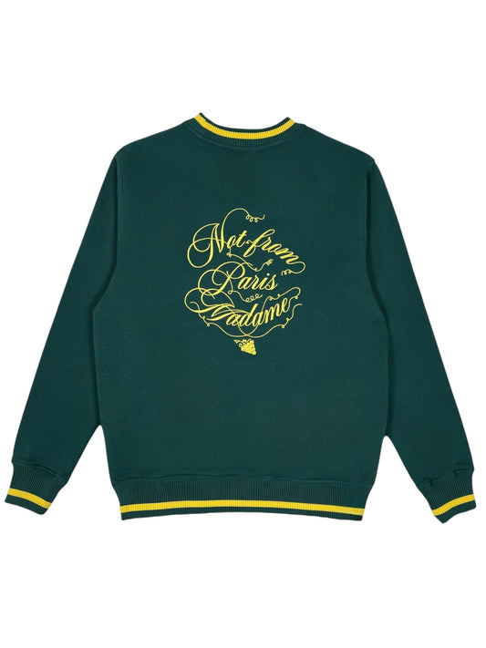 The Drôle de Monsieur F-SW156-CO127-Dgn Le Sweatshirt Green is a dark green French terry sweatshirt with a "Not from Paris Madame" Slogan Vignes print on the back, elegantly scripted and accented with yellow trim on the cuffs and collar.