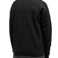 A person is seen from the back, wearing a Drôle de Monsieur black cardigan over a white collared shirt and gray pants, against a plain white background.