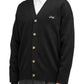 Someone is wearing a black Drôle de Monsieur cardigan (Perm-CA123-WO007-BL) with Drôle embroidery, paired with a white shirt.