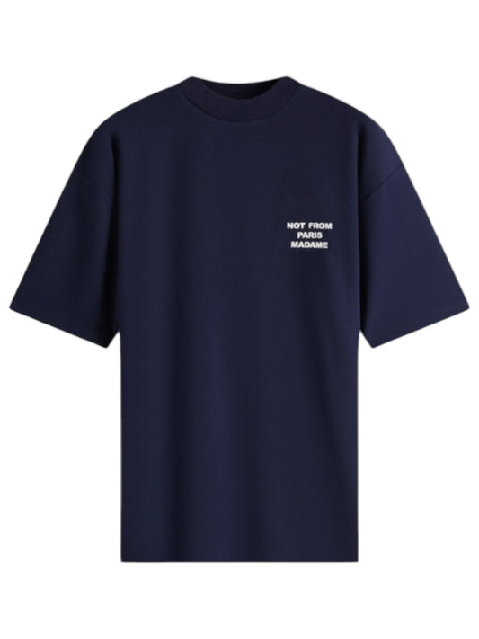 Introducing the Drôle de Monsieur TS203-Co002-NY Le T-Shirt Slogan Navy, crafted from soft cotton interlock fabric. This standout piece for any casual wardrobe features a bold white slogan on the front that reads "NOT FROM PARIS MADAME.