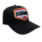 The DSQUARED2 BCM0763 Logo Baseball Cap Col.2124 is a black Canada tribute cap featuring a colorful "DSQUARED2" logo patch with "Canadian Twins 1964-1995" prominently embroidered on the front. Made from 100% cotton, it also has an adjustable strap for a perfect fit.