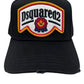 The DSQUARED2 BCM0847 Nero cap displays a "Dsquared2" logo patch with a maple leaf and mountain design. Made from cotton gabardine, it features subtle distressed details for a stylish, worn-in appearance.