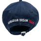 Back view of the DSQUARED2 BCM0917 Navy Baseball Cap featuring "CANADIAN DREAM TEAM" embroidered in white and red. This stylish trucker hat offers an adjustable strap and buckle for a perfect fit.
