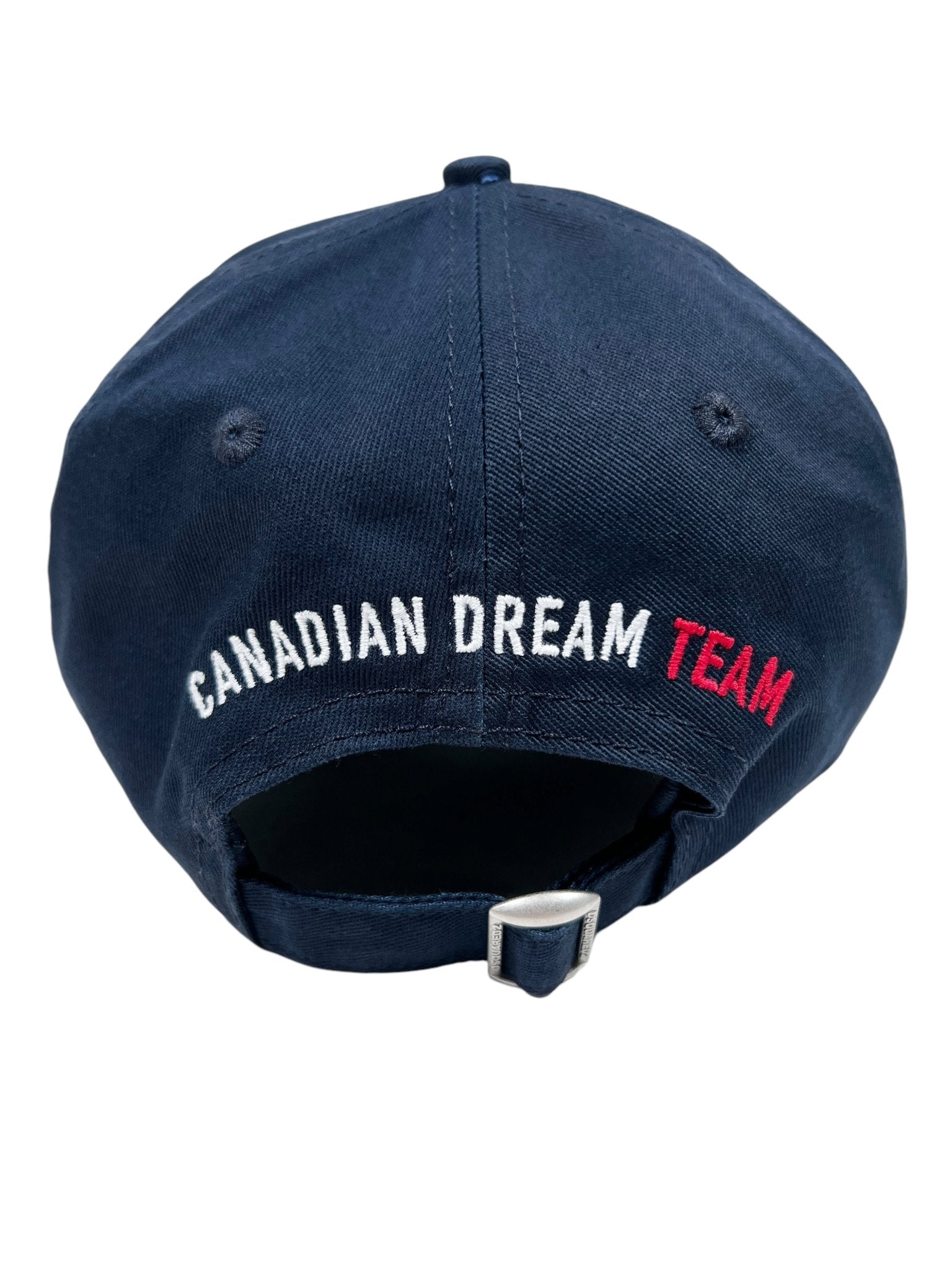 Back view of the DSQUARED2 BCM0917 Navy Baseball Cap featuring "CANADIAN DREAM TEAM" embroidered in white and red. This stylish trucker hat offers an adjustable strap and buckle for a perfect fit.