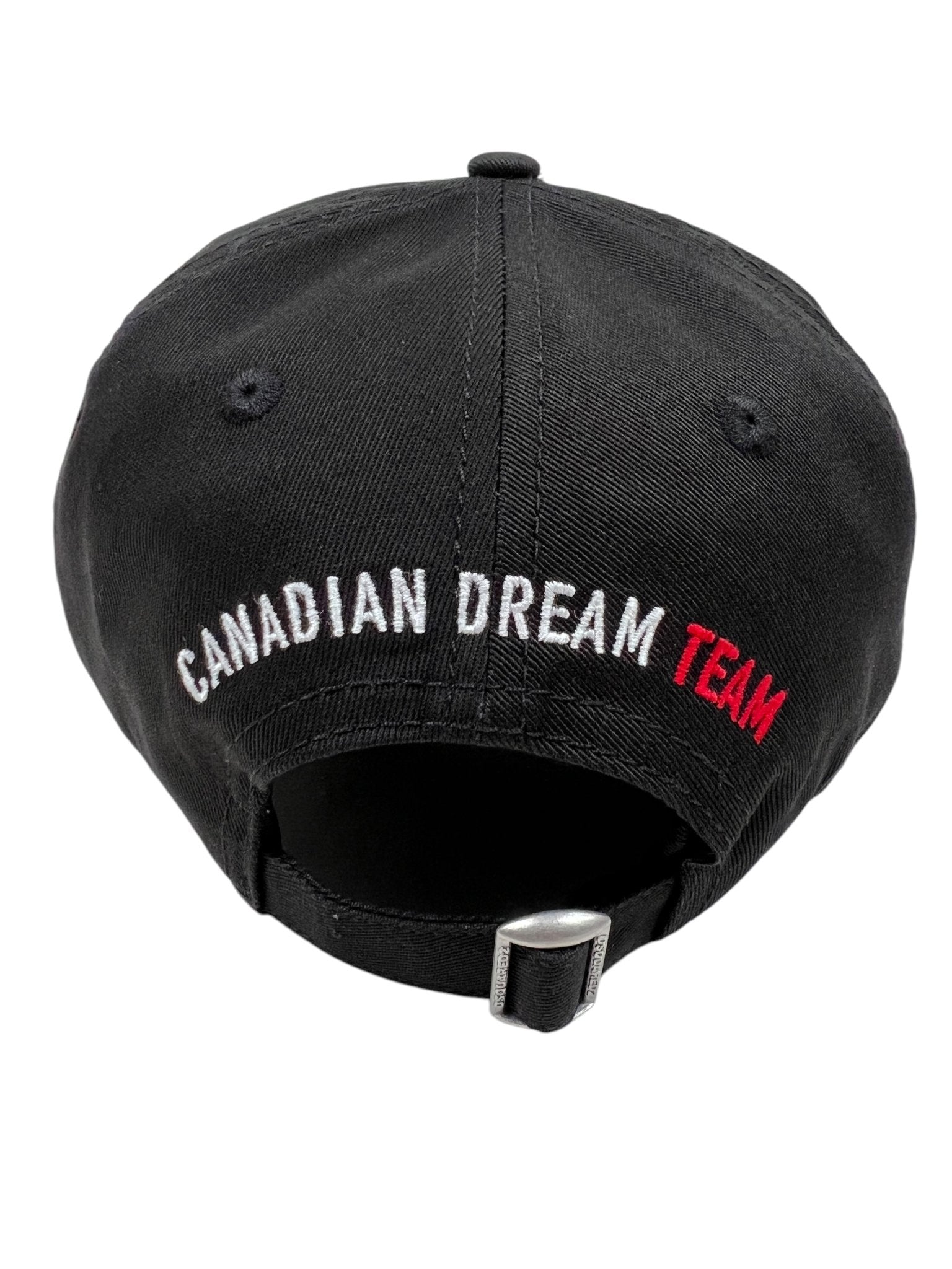 The DSQUARED2 BCM0917 Baseball Cap in Gabardine-Nero features "CANADIAN DREAM TEAM" embroidery on the back. Made from premium cotton, it offers a comfortable feel and adjustable fit for style and versatility.