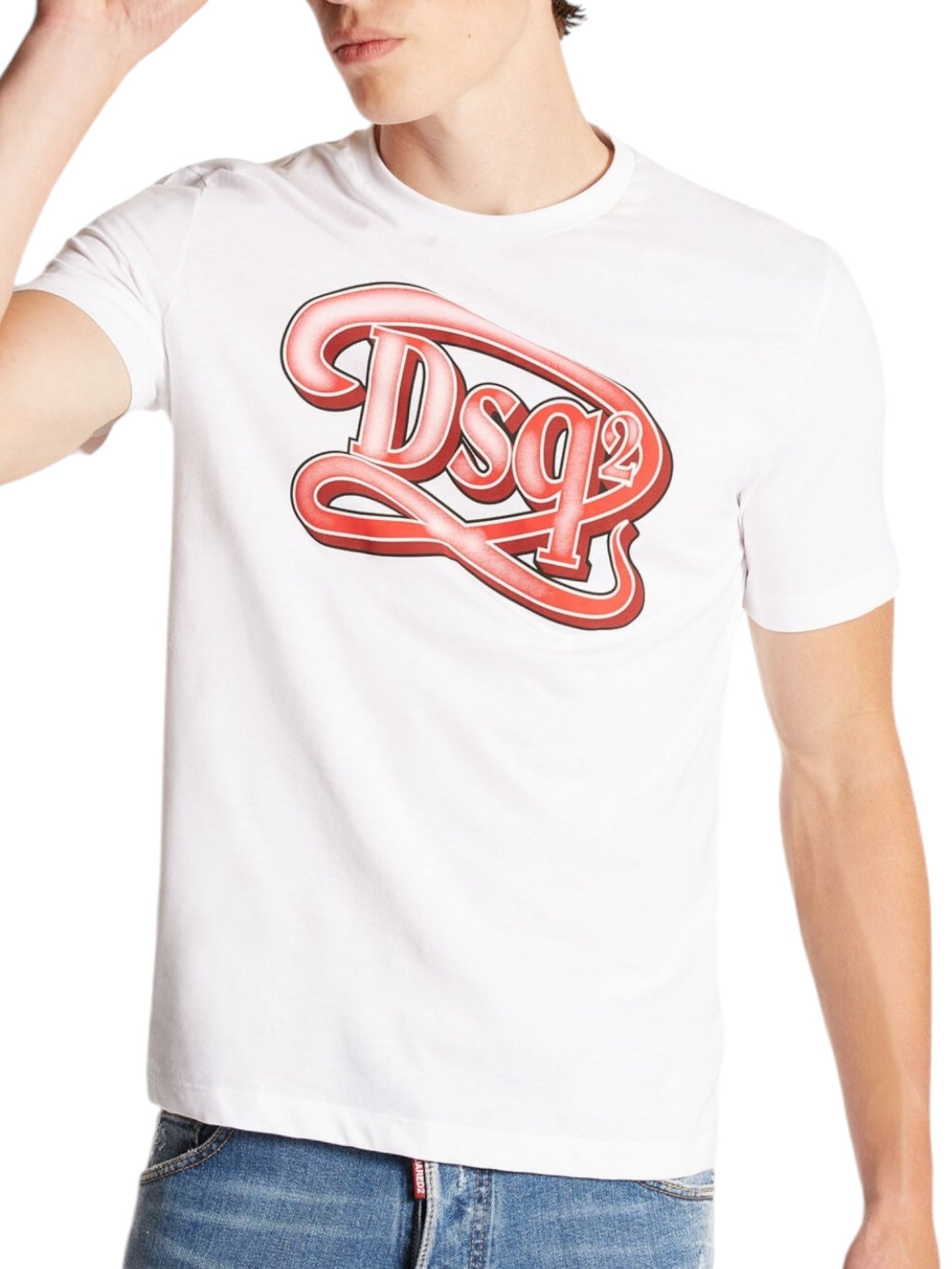 An individual is sporting the DSQUARED2 S71Gd1387 Regular Fit Tee Wht, a 100% cotton T-shirt featuring a bold red "DSQ2" logo. Made in Romania, this white T-shirt pairs effortlessly with blue jeans to enhance the classic denim style.