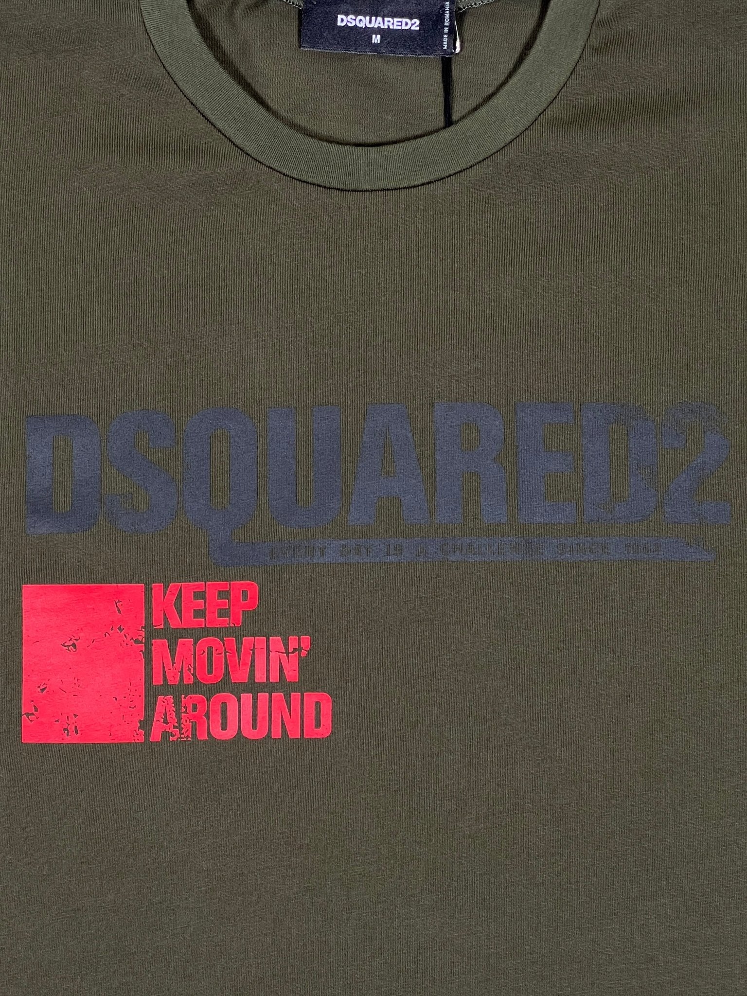 Dsquared2 S71GD1462 Cool Fit Tee Green with a faded large DSQUARED2 logo at the top and "KEEP MOVIN' AROUND" in bold red text.
