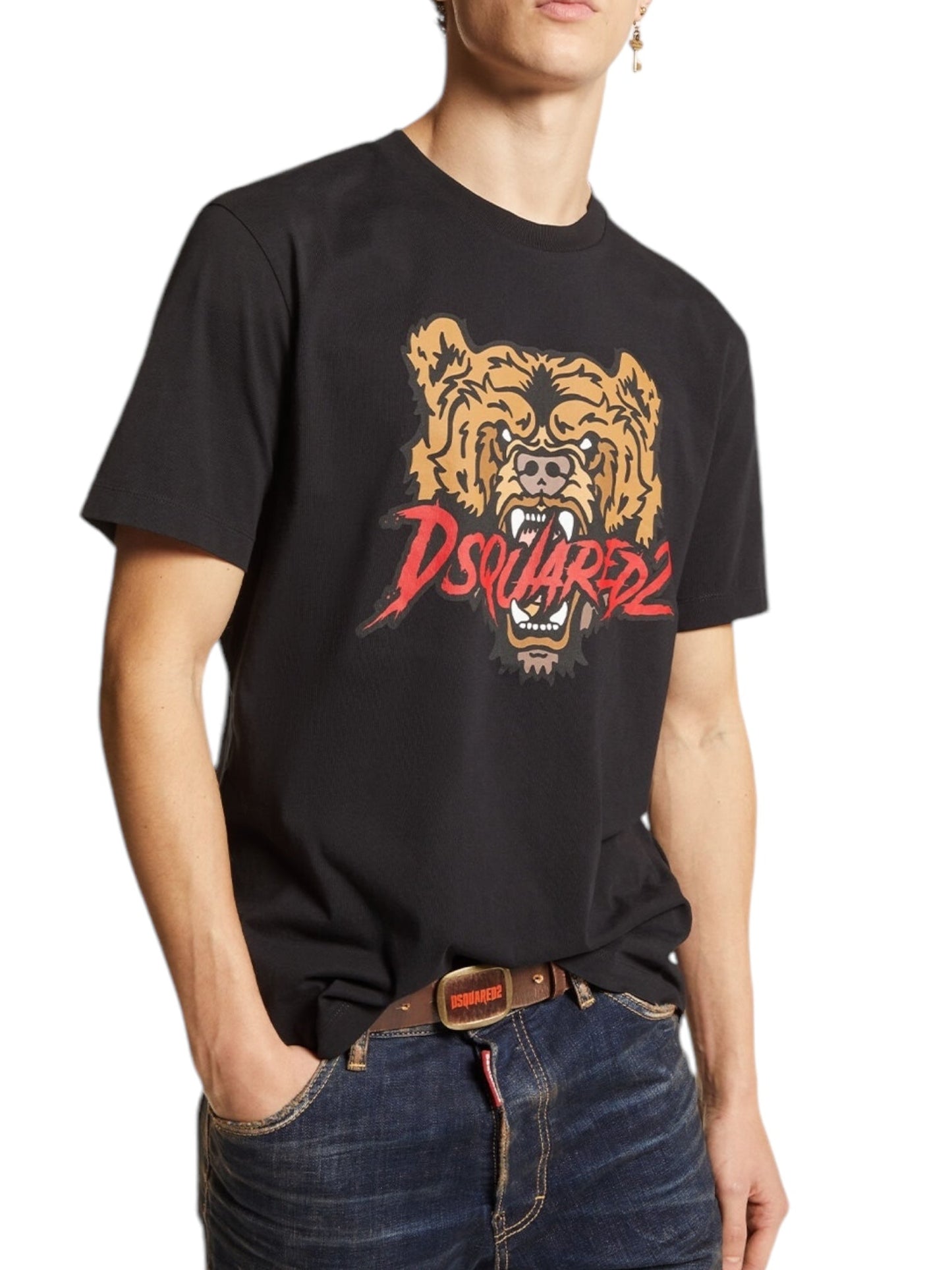 A person wearing a Dsquared2 S74Gd1316 Regular Fit Tee in black, designed by DSQUARED2 and made in Portugal from 100% cotton, featuring a roaring bear graphic, paired with blue jeans.