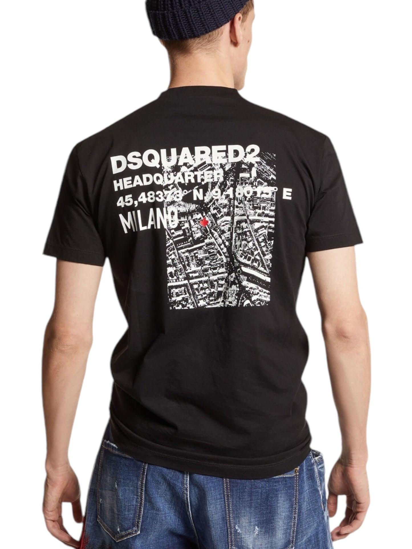 A person is seen from the back sporting men's fashion in a black Dsquared2 S74Gd1338 Cool Fit Tee, featuring white graphic text that includes "DSQUARED2" and references their Milan headquarters. The ensemble is effortlessly stylish when paired with blue jeans and a black beanie.