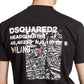 A person dons a Dsquared2 S74Gd1338 Cool Fit Tee Black from DSQUARED2, showcasing a sleek black design with a white map and the text "DSQUARED2 Headquarters" and "Milano" on the back, epitomizing modern men's fashion.