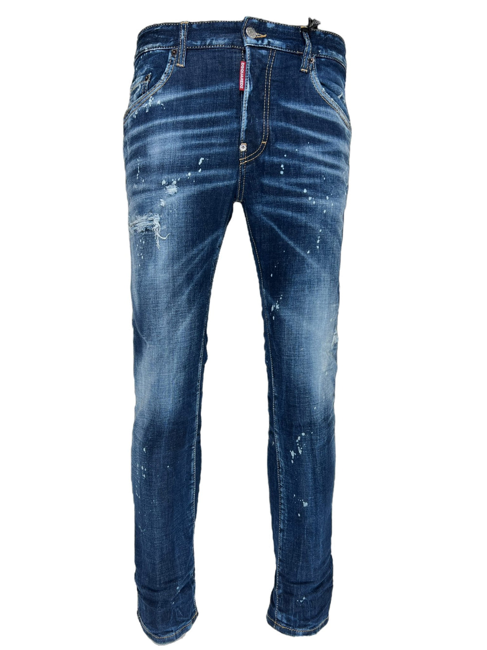 A pair of DSQUARED2 S74LB1556 SKATER JEANS NAVY BLUE with a faded effect, paint splatters, and a button-fastened waistband. These trendy ripped detailing offer a stylish slim fit for those who want to elevate their casual look.