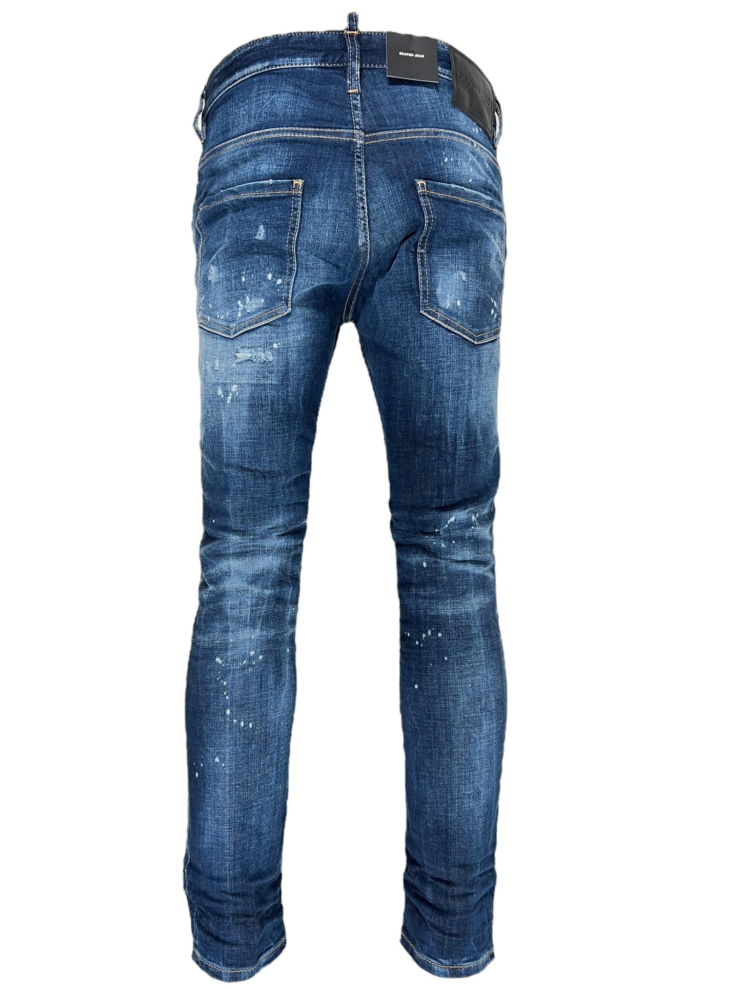 Back view of a pair of stylish slim fit blue jeans with white paint splatters, showcasing worn and distressed details on the fabric and stitching, embodying the trendy ripped detailing reminiscent of DSQUARED2 S74LB1556 SKATER JEANS NAVY BLUE.