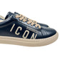 A pair of DSQUARED2 SNM0384 Cassetta Sneakers in navy with beige laces, crafted from premium leather and showcasing "ICON" prominently on the side.