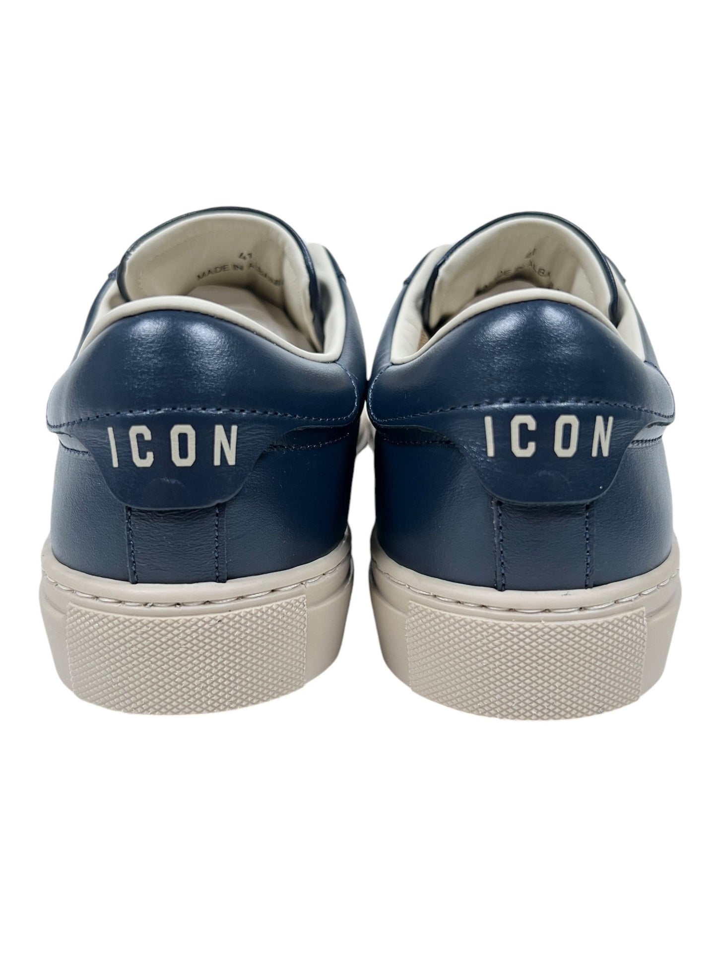 The Dsquared2 SNM0384 Cassetta Sneakers in navy and beige from DSQUARED2 are made from premium leather and feature the word "ICON" printed in white on the back heel area, set against a plain background.