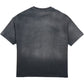 The DUAA Duaa Destination Blk Tee Shirt is a faded black graphic tee shown from the back, featuring subtle distressed details and faint, barely visible graphic designs.