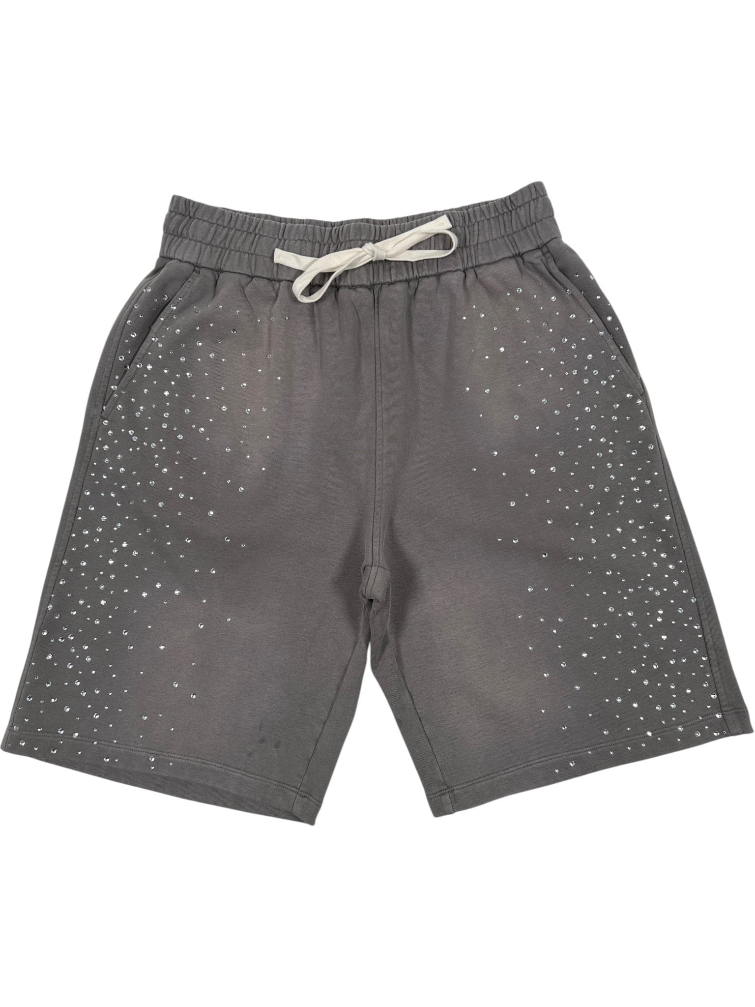 The DUAA Duaa "Effort" Lite Grey Stone Sweat Short features an elastic waistband, soft cotton fabric, and a small white dot pattern scattered across the front for comfort and style.