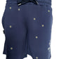 The FAMILY FIRST JOSS2503 Short Flower Dark Blue are navy cotton shorts with an elastic waistband, drawstring, and small white flower patterns.