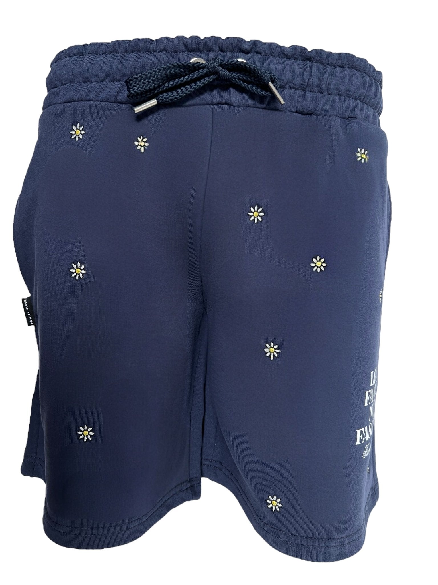 The FAMILY FIRST JOSS2503 Short Flower Dark Blue are navy cotton shorts with an elastic waistband, drawstring, and small white flower patterns.