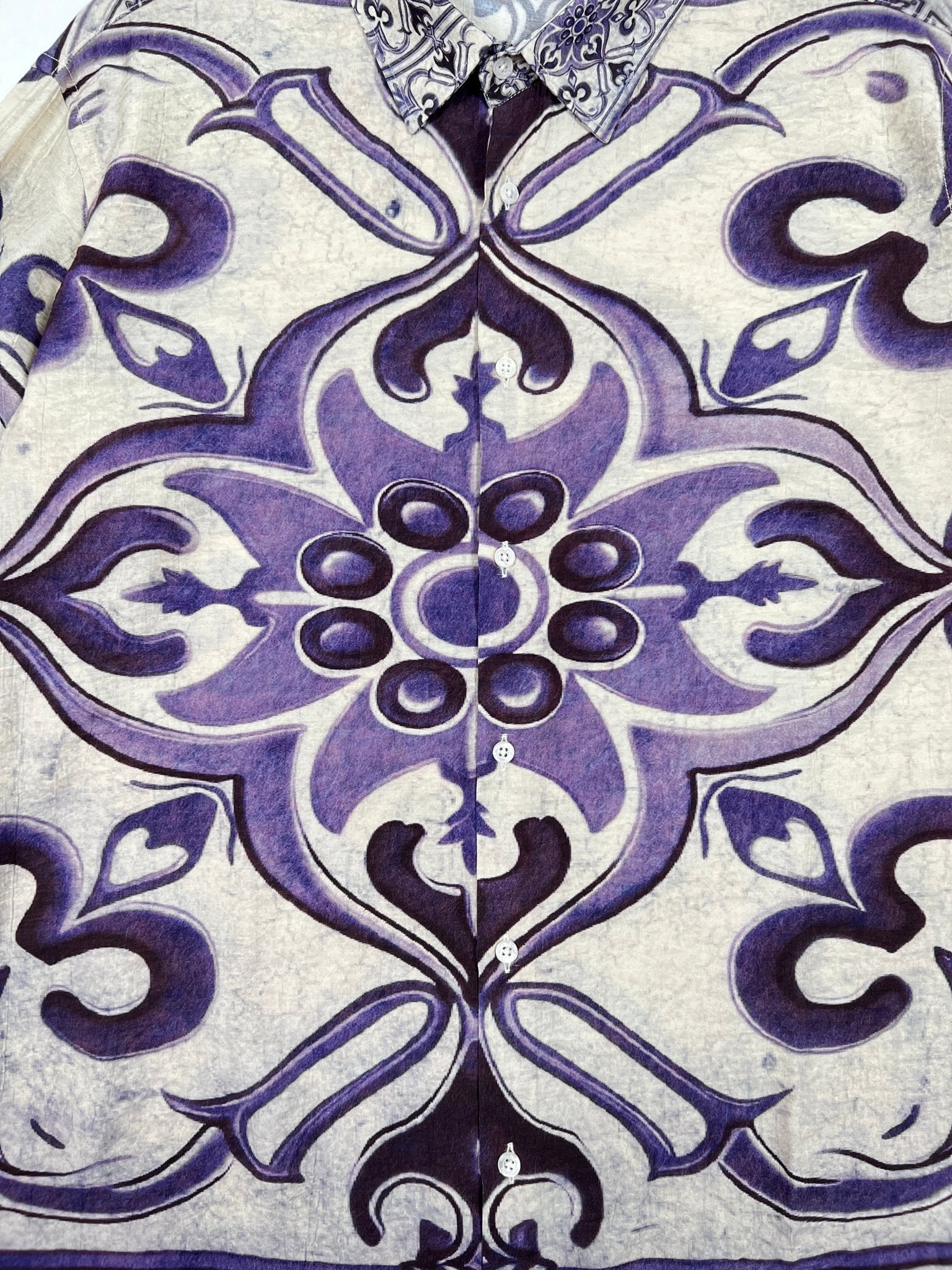 Close-up of the Family First SHS2504 Shirt Amalfi Multicolor by FAMILY FIRST, showcasing an intricate multicolor abstract floral design with purple and black paisley on a light background, expertly crafted from luxurious Ramie fabric.