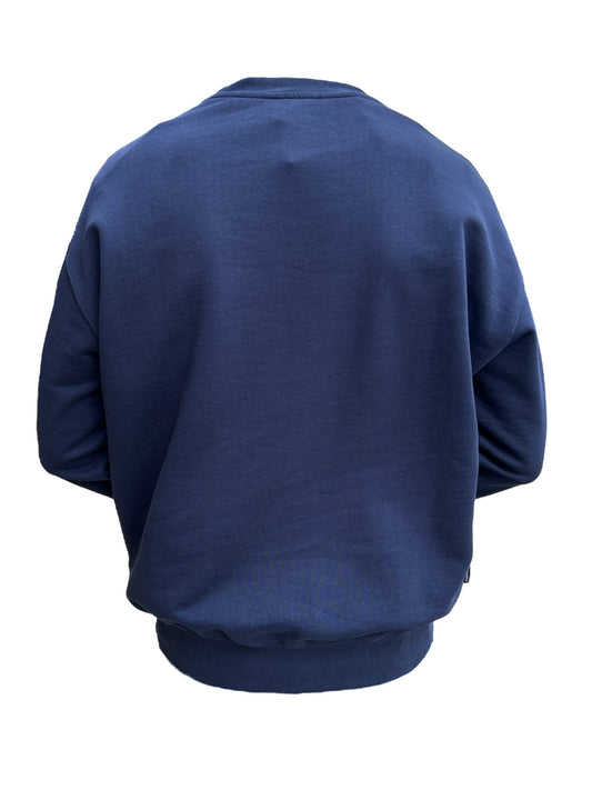 Rear view of a person wearing a FAMILY FIRST SS2402 CREWNECK COLLEGE DB navy blue sweatshirt against a black background.