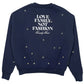 The Family First SS2502 Sweat Flower in Dark Blue by FAMILY FIRST showcases "LOVE FAMILY NOT FASHION" text, with small star designs and delicate embroidered flowers on the back.