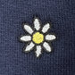The Family First SS2502 Sweat Flower Dark Blue sweatshirt by FAMILY FIRST features an intricately embroidered white daisy with a yellow center on a dark blue fabric background, highlighting beautiful floral embroidery.