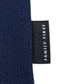 A close-up of a black fabric tag with "FAMILY FIRST" in white text complements the textured dark blue fabric of the Family First T2502DB T-shirt Flower.