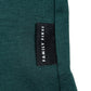 A close-up of the luxurious green ribbed fabric of the Family First TF2409GR T-shirt Symbol Green highlights a sophisticated black label with "FAMILY FIRST" in white text.