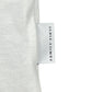 A white fabric label with "FAMILY FIRST" is skillfully sewn into the seam of a gray Family First TS2504 T-shirt Heart Tone White, adding authenticity.