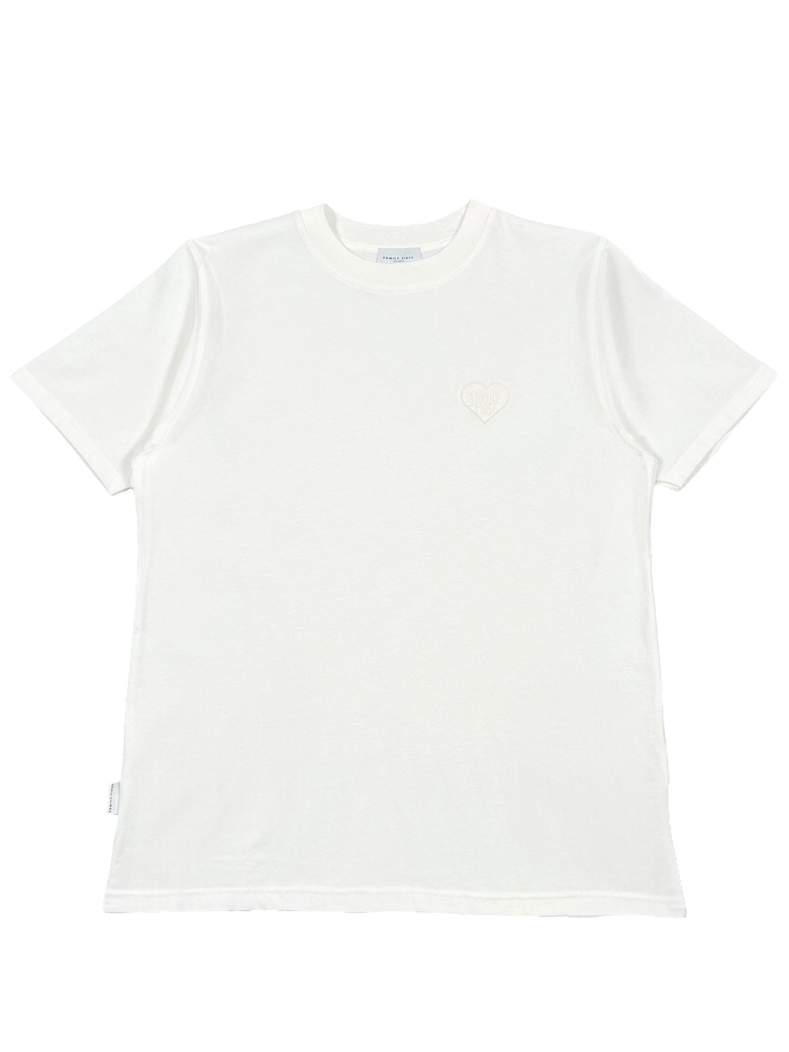Family First TS2504 T-shirt by FAMILY FIRST, white with short sleeves, features a small embroidered heart emblem on the front. Simple design on plain background.