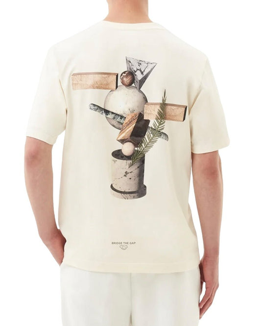 Person wearing the FILLING PIECES BALANCE ANTIQUE WHITE T-SHIRT, made from organic cotton, with a unique back print featuring geometric and botanical designs, standing against a plain background.