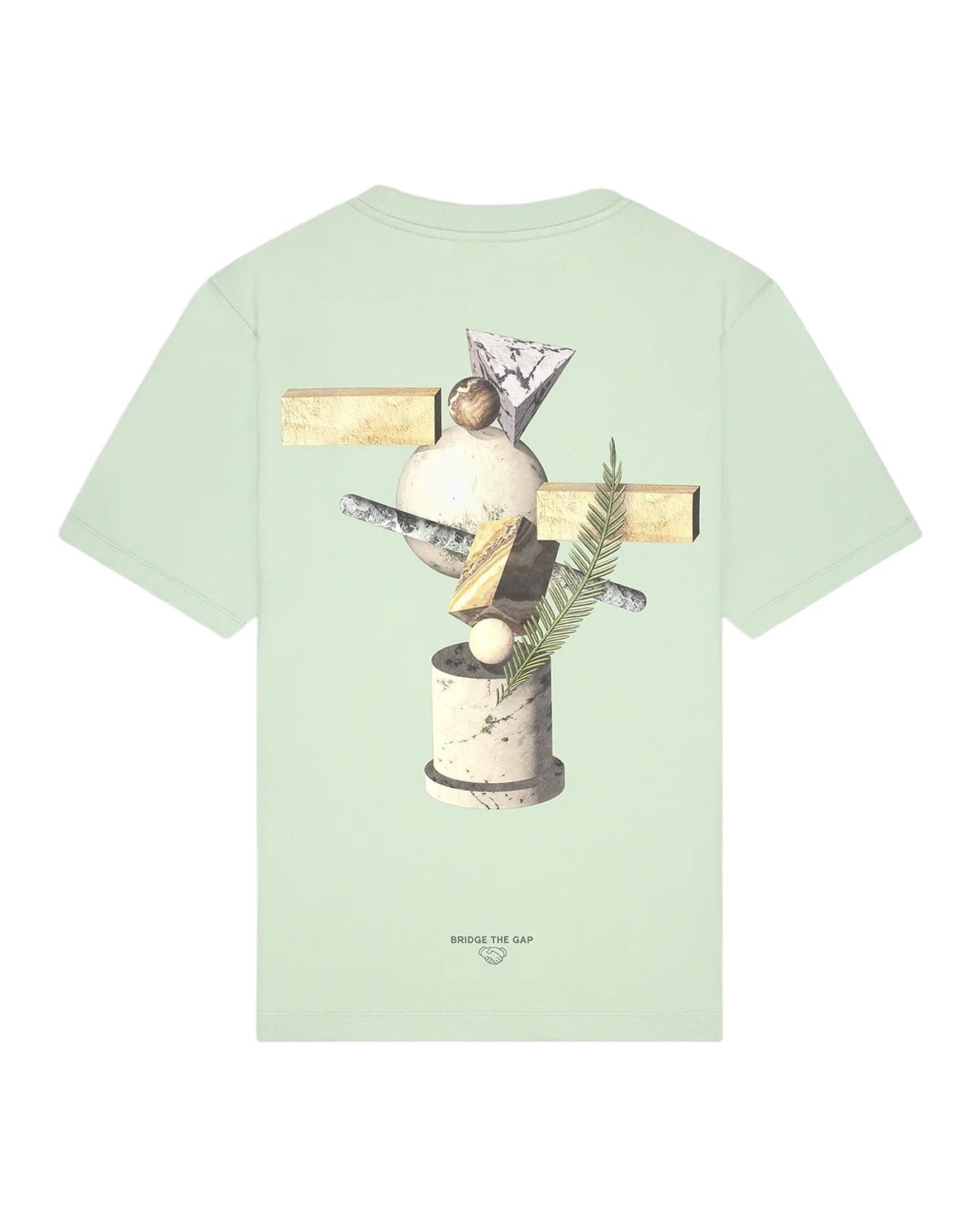 The FILLING PIECES BALANCE Frosty Green T-shirt is a comfortable, organic cotton garment featuring a unique backprint with geometric and nature-themed designs, including abstract shapes and a small plant. The phrase "Bridge the Gap" is printed near the bottom.