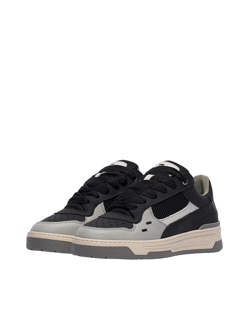 The FILLING PIECES Cruiser Black sneakers feature a sophisticated blend of black and gray low-top design, complemented by black laces, beige soles, and mesh accents on the sides. Crafted with premium Nappa leather, these shoes offer an added touch of luxury.