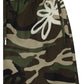 Close-up of the Filling Pieces Flower Shorts Camo by FILLING PIECES, showcasing a green and brown camouflage pattern with a white embroidered flower near the pocket.