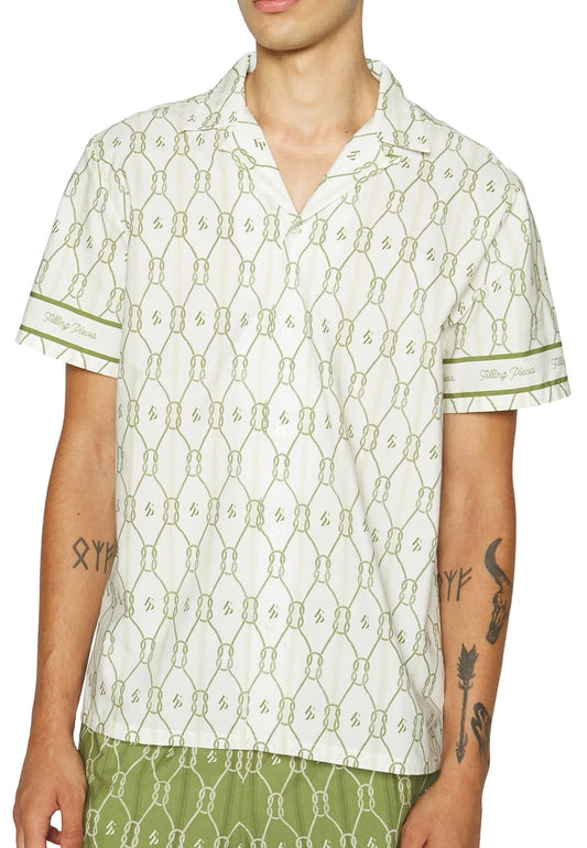 Person wearing a FILLING PIECES RESORT MONOGRAM SHIRT MILK with a collar, tattoos visible on the arms.